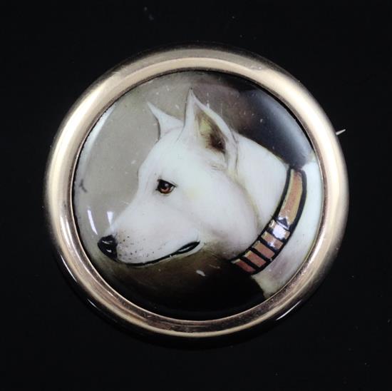 John William Bailey-(active 1860-1910) a gold mounted enamel brooch inset with a portrait of a bull terrier dia. 38mm.